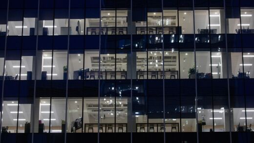 Lights illuminate office floors in the Societe Generale SA building in the Canary Wharf business, financial and shopping district of London, U.K., on Monday, Sept. 14, 2020. Londoners are steadily increasing their use of public transport after schools reopened, freeing parents to go back to the workplace. Photographer: Simon Dawson/Bloomberg
