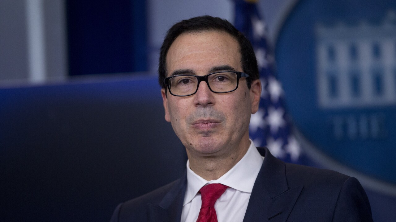 Steven Mnuchin, U.S. Treasury secretary, listens to a question during a White House press briefing in Washington.