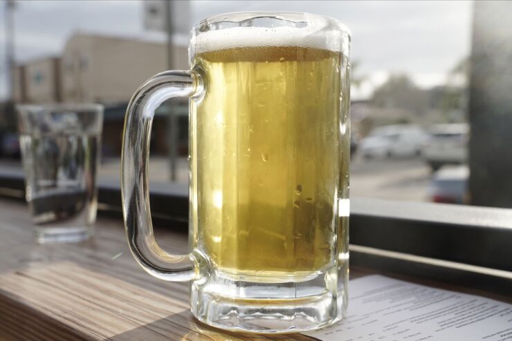 A mug of beer sits on the counter at a bar in the Ocean Beach neighborhood of San Diego, California, U.S., on Monday, June 29, 2020. Bars are required to shut in seven counties -- including Los Angeles -- and they're recommended to close in eight others, including Sacramento and Santa Barbara, following a surge in coronavirus cases, according to an order by Governor Gavin Newsom on Sunday. Photographer: Bing Guan/Bloomberg