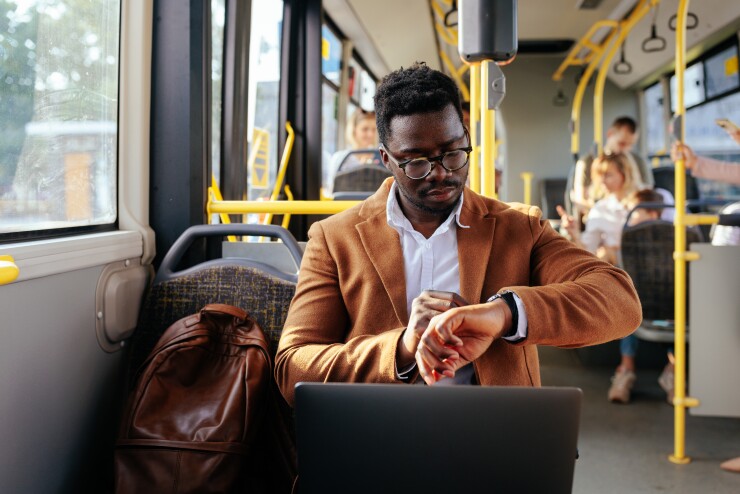 Man commuting on a bus