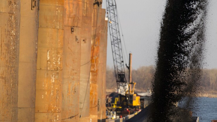 Barge being filled with coal along the Mississippi River