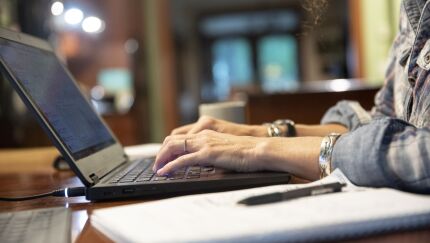 A person uses a laptop computer while working from home in an arranged photograph taken in Tiskilwa, Illinois, U.S., on Tuesday, Sept. 8, 2020. Coronavirus cases in the U.S. increased 0.4% as compared with the same time Monday to 6.32 million, according to data collected by Johns Hopkins University and Bloomberg News. Photographer: Daniel Acker/Bloomberg