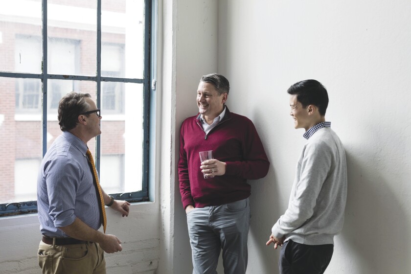 Texting is one way Mirador Capital Partners has updated its communication with clients, says Dan Murray (l.), a principal, in conversation with Adrian Jones (c.), the firm’s executive vice president, and co-portfolio manager Jonathan Ting.