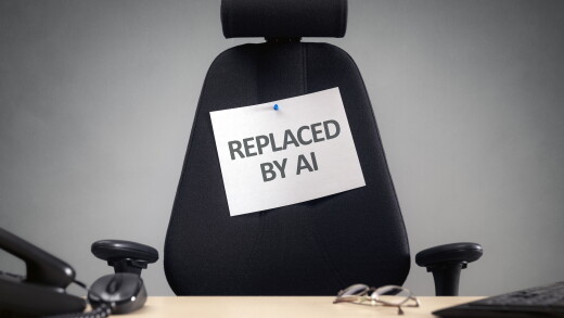 Empty chair with "replaced by AI" sign