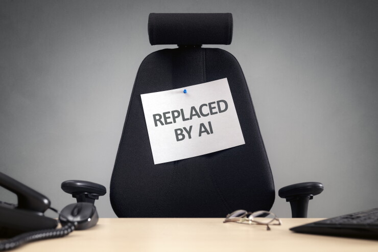 Empty chair with "replaced by AI" sign