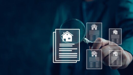 Images of houses and documents under magnifying glass