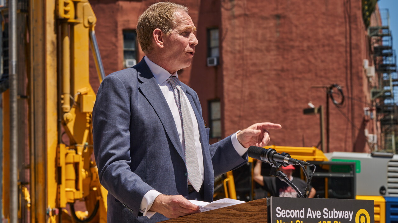 Janno Lieber behind podium at construction site