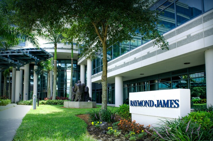 A Raymond James sign outside an office