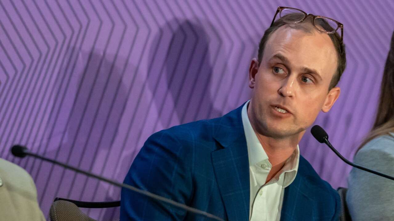 Tyler Traudt speaks on a conference panel