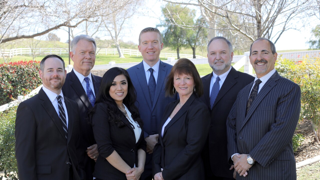 Stifel recently picked up a former Merrill Lynch team that oversaw nearly $600 million in client assets. From left to right: Ron Benoit, Greg Munro, Coni Resendiz, Robert Babcock, Peg Allen, Tony Ondracek and Gary Allen.