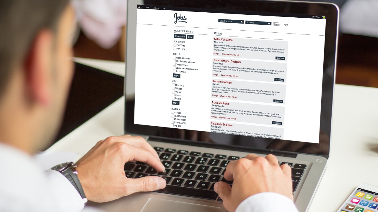 Man looking for jobs on laptop; online