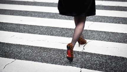 A pedestrian crosses a street in Tokyo on Feb. 8, 2019.
