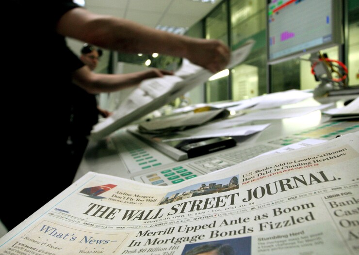 A printer checks copies of the Wall Street Journal in Rainham, Essex, U.K., on Wednesday, April 16, 2008. Bloomberg News.