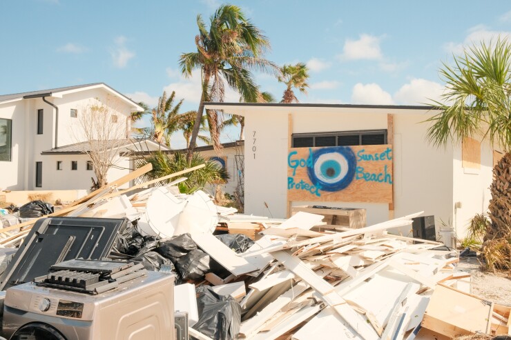 Debris in front of home damaged in Hurricane Milton