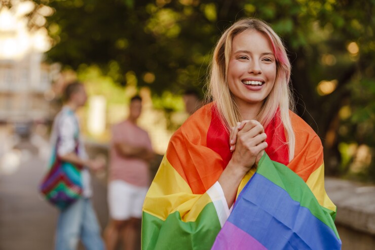 Woman with pride flag.