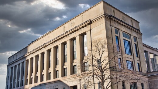 Joseph P. Kinneary U.S. Courthouse in downtown Columbus, Ohio, with a stormy sky.