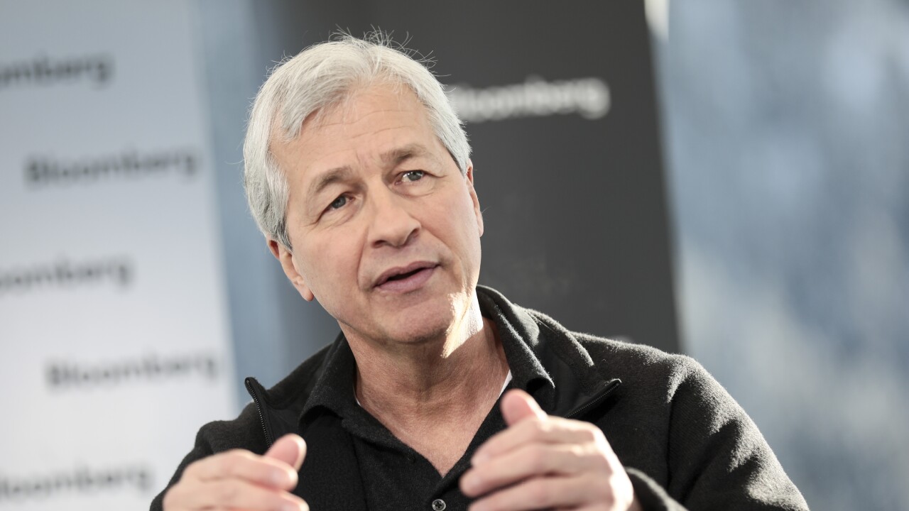 Jamie Dimon, chief executive officer of JPMorgan Chase, gestures as he speaks during an interview at the World Economic Forum in Davos, Switzerland.