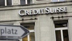 A sign hangs outside the offices of Credit Suisse headquarters in Zurich, Switzerland.