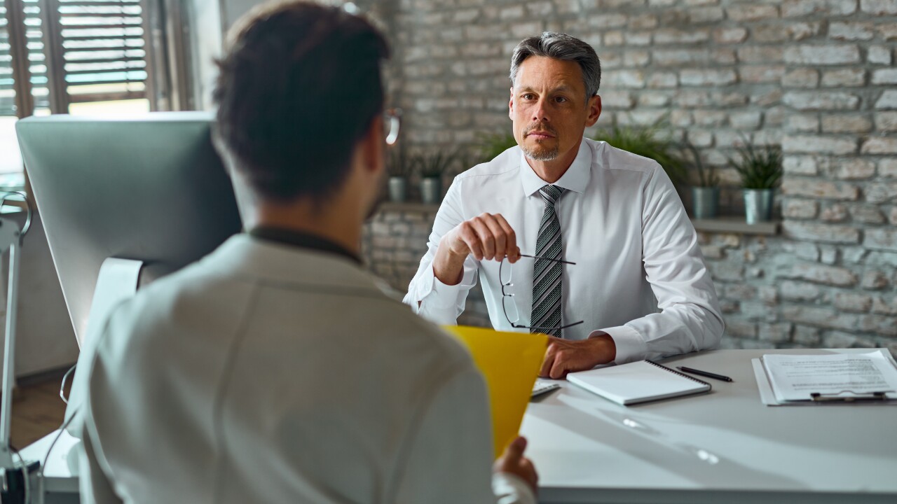 Man sitting in an interview.
