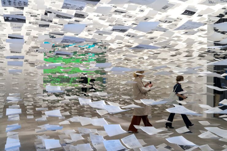 Visitors walk through an installation entitled "Uncertainty" created from pieces of paper generated from various architecture projects at the Spanish Pavilion in Giardini della Biennale during the Biennale of Architecture in Venice, Italy, on May 20, 2021. This year's Biennale, which was supposed to take place last year but was delayed by the Covid-19 pandemic, is titled, presciently, "How Will We Live Together?"