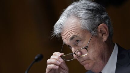 Jerome Powell, chairman of the Federal Reserve, removes his glasses during a Senate Banking, Housing and Urban Affairs Committee hearing in Washington on Sept 24, 2020.