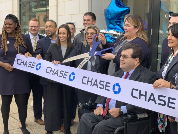 Diana Jimenez, branch manager of the Chase bank branch near Gallaudet University, cutting the ribbon