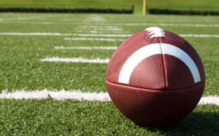 A football on a field.