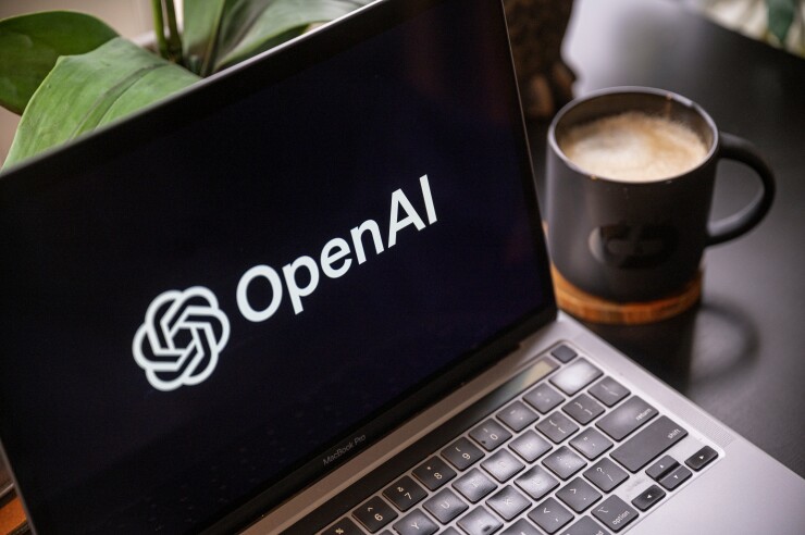The Open AI logo displayed on a laptop screen