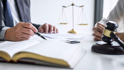 Consultation and conference of professional businesswoman and Male lawyers working and discussion having at law firm in office. Concepts of law, Judge gavel with scales of justice