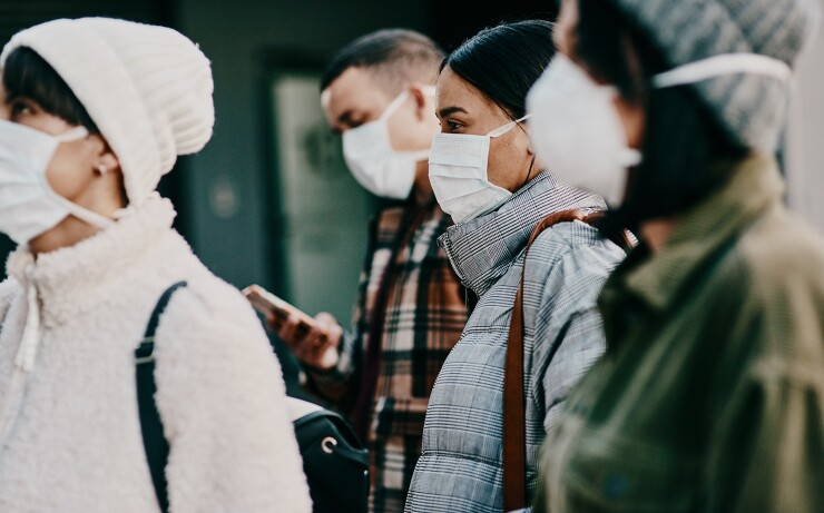 A group of people wearing masks.