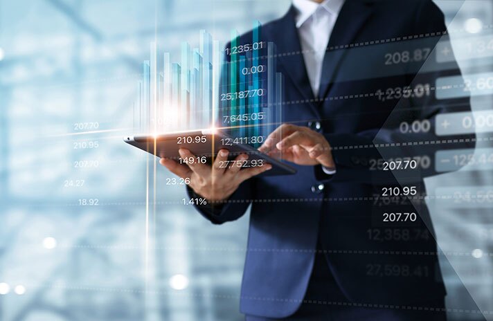 Businessman using tablet analyzing data.