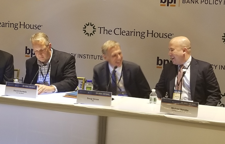 Doug Gross, Division Executive, Corporate Banking Solutions, FIS and Michael Nonaka, Partner, Covington & Burling, share a laugh.