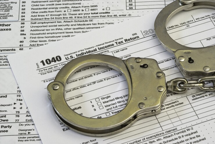 Form 1040 with handcuffs