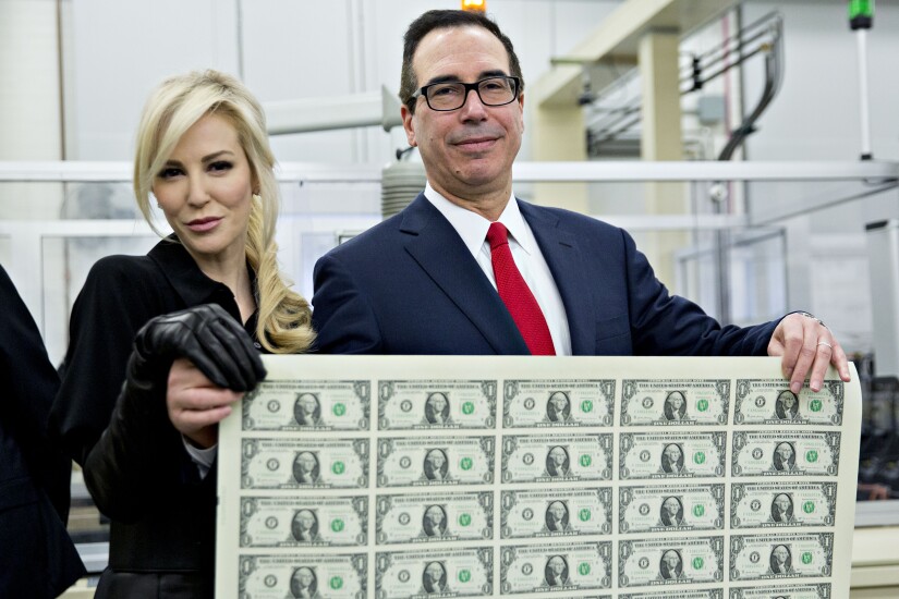 Treasury Secretary Steven Mnuchin with wife, actress Louise Linton. Also with money, currency