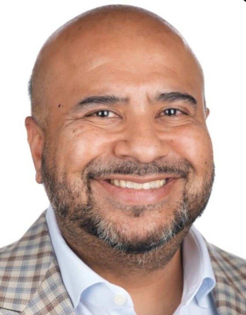 A man smiling for a photo.