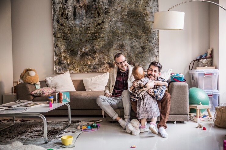 Gay family with daughter at home