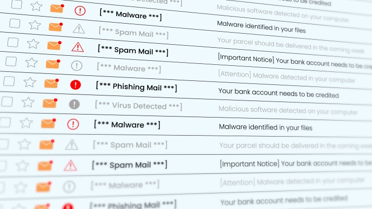 Email inbox on a computer screen showing phishing emails