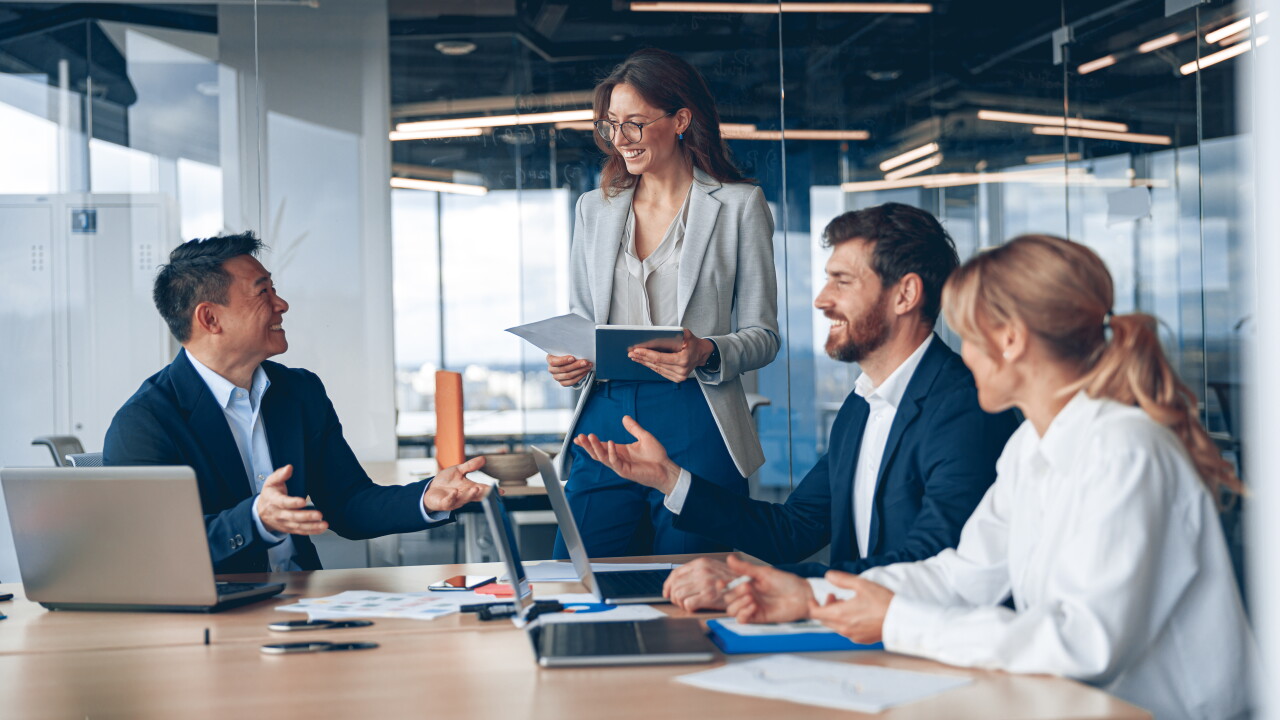A group of business people partners during a set team meeting in the modern office.