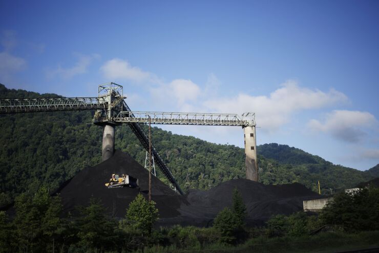 A bulldozer operates on a coal mound at the Alpha Natural Resources Inc. Mammoth Preparation Plant in London, West Virginia, U.S., on Wednesday, July 18, 2018.