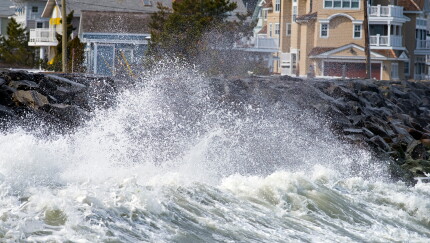 Coastal homes, waves crashing