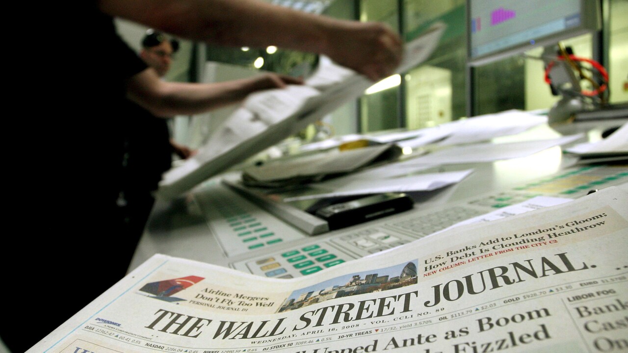 A printer checks copies of the Wall Street Journal in Rainham, Essex, U.K., on Wednesday, April 16, 2008. Bloomberg News.