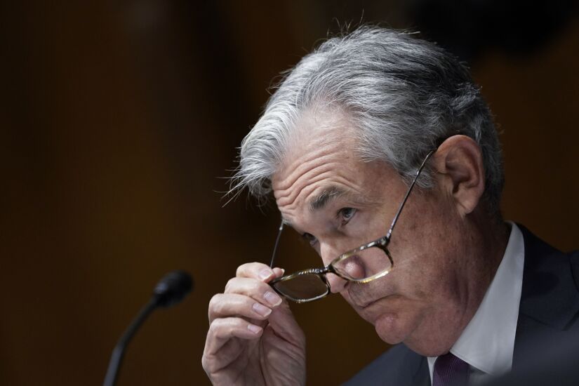 Jerome Powell, chairman of the Federal Reserve, removes his glasses during a Senate Banking, Housing and Urban Affairs Committee hearing in Washington on Sept 24, 2020.
