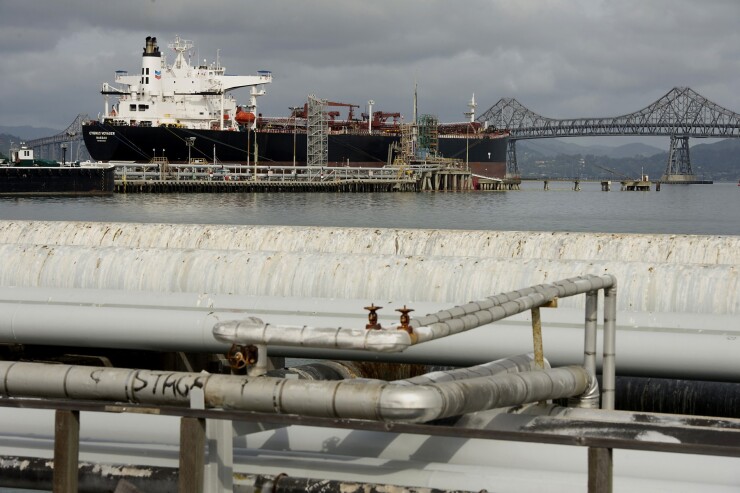 A Chevron Corp. oil tanker sits at the end of the Chevron Corp. Richmond Refinery in Richmond, California, U.S., on Thursday, April 24, 2014.