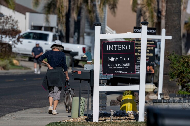 Real estate signage outside residential homes in Discovery Bay, California, US
