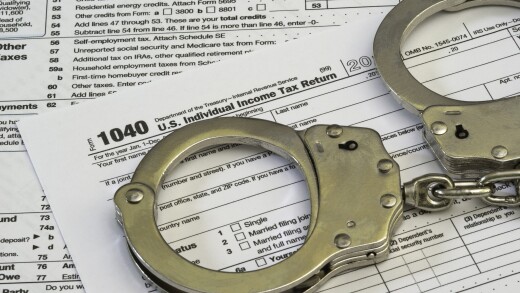 Form 1040 with handcuffs