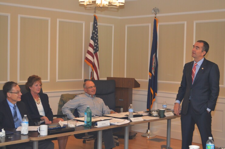 Virginia Lt. Gov. Ralph Northam (right) met recently with members of the Virginia CU Leauge board. From left (seated) is John Beiler, CEO of Park View Federal Credit Union; Patsy Stuard, CEO of Fort Lee Federal Credit Union; and Joe Thomas, CEO of Fairfax County Federal Credit Union.