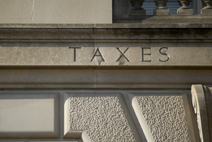 The word "taxes" is engraved on the side of IRS headquarters in Washington, D.C.