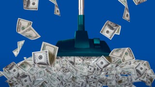 An illustration displays a green vacuum cleaner inhaling $100 bills in front of a blue background