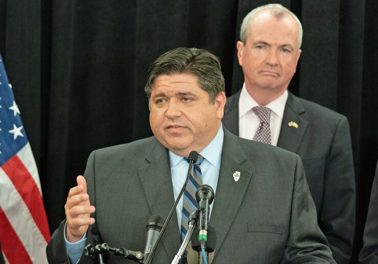 Illinois Gov. J.B. Pritzker, with New Jersey Gov. Phil Murphy in the background, at an event pushing for restoration of SALT decuctions in New York, Feb. 22, 2019.