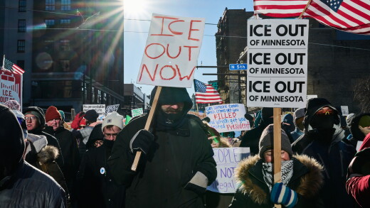Minneapolis protesters with "ICE out" signs in January